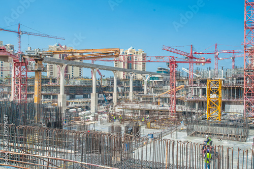 DUBAI - MARCH 03: builder sits on scaffolding, road construction in Dubai, Palm Jumeirah Dubai MARCH 03, 2016