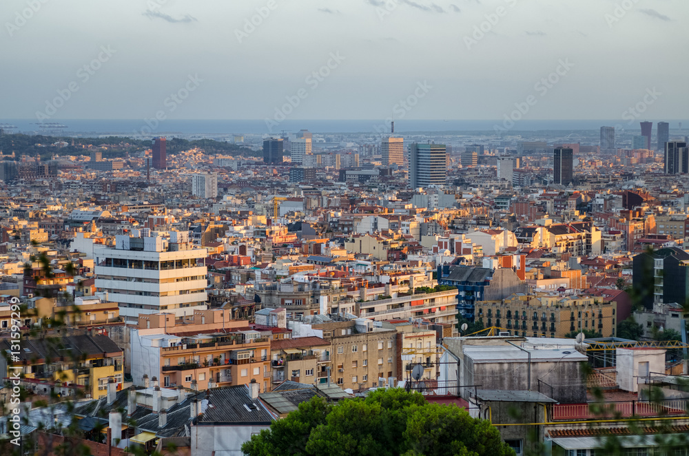 Barcelona cityscape and sea in sunset light, Spain