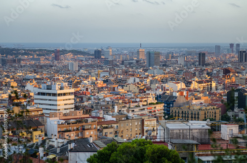 Barcelona cityscape and sea in sunset light, Spain