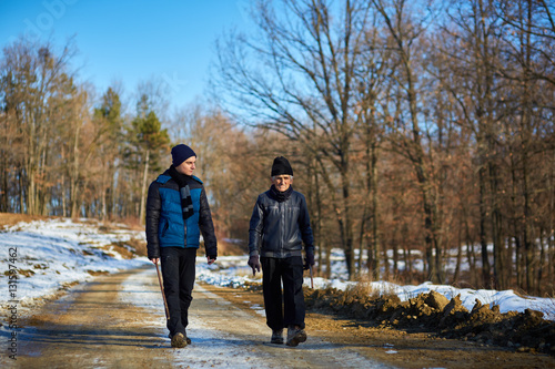 Old man and grandson walking in the countryside © Xalanx