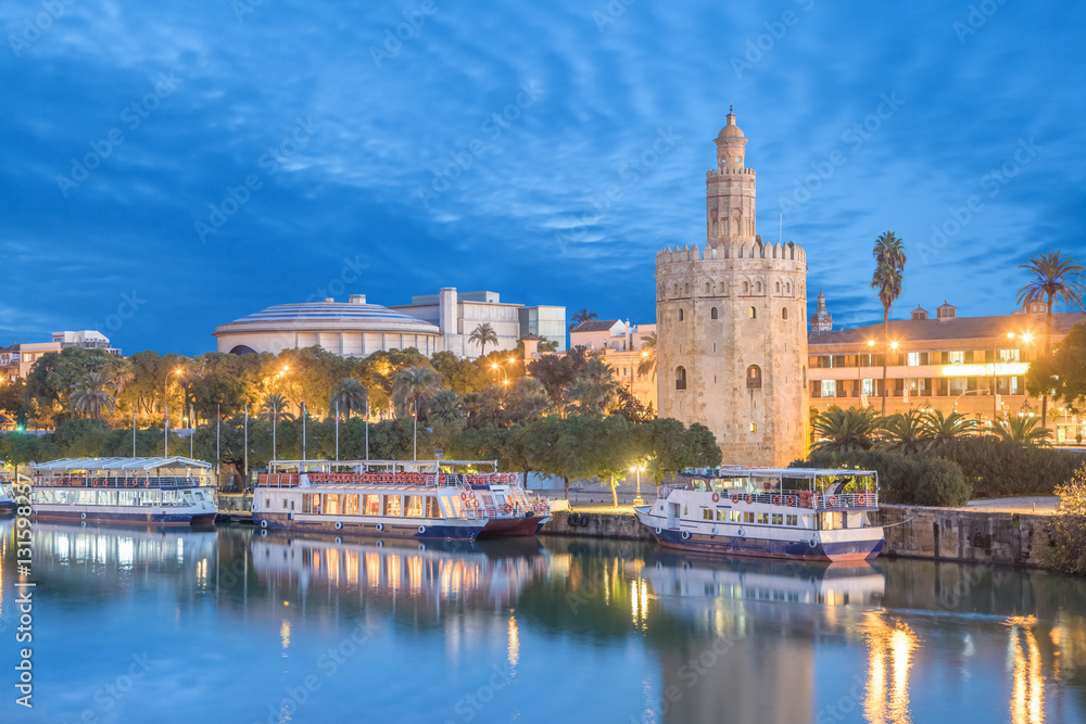 Fototapeta premium Illuminated Torre del Oro (Golden tower) in Seville, Andalusia, Spaim
