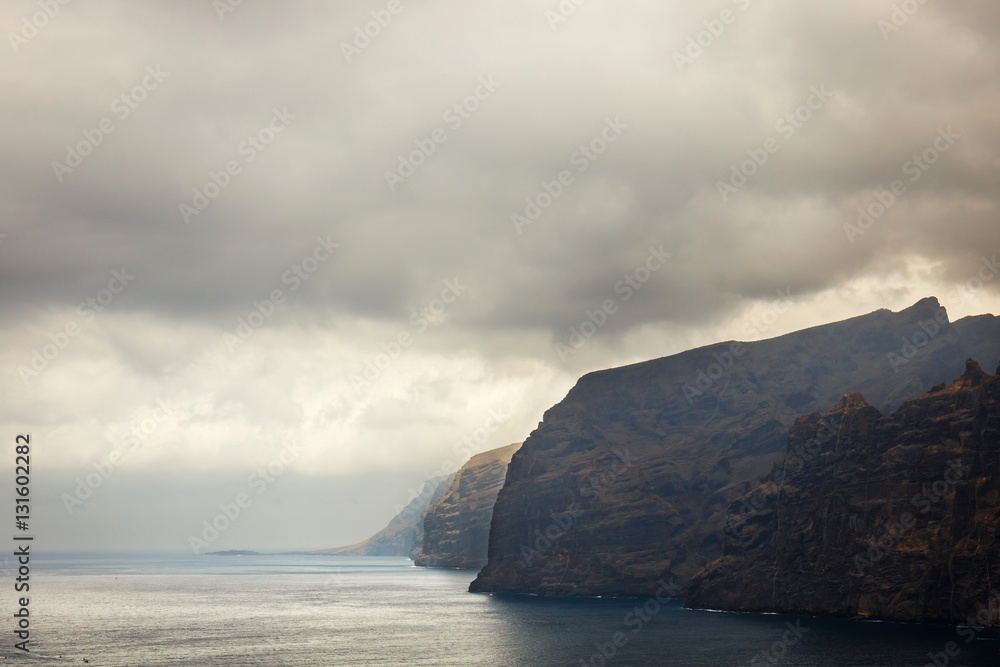view of the cloudy cliffs of Los Gigantes in Tenerife, Canary Islands, Spain