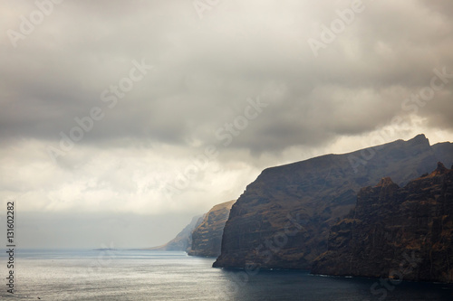 view of the cloudy cliffs of Los Gigantes in Tenerife, Canary Islands, Spain © dziewul