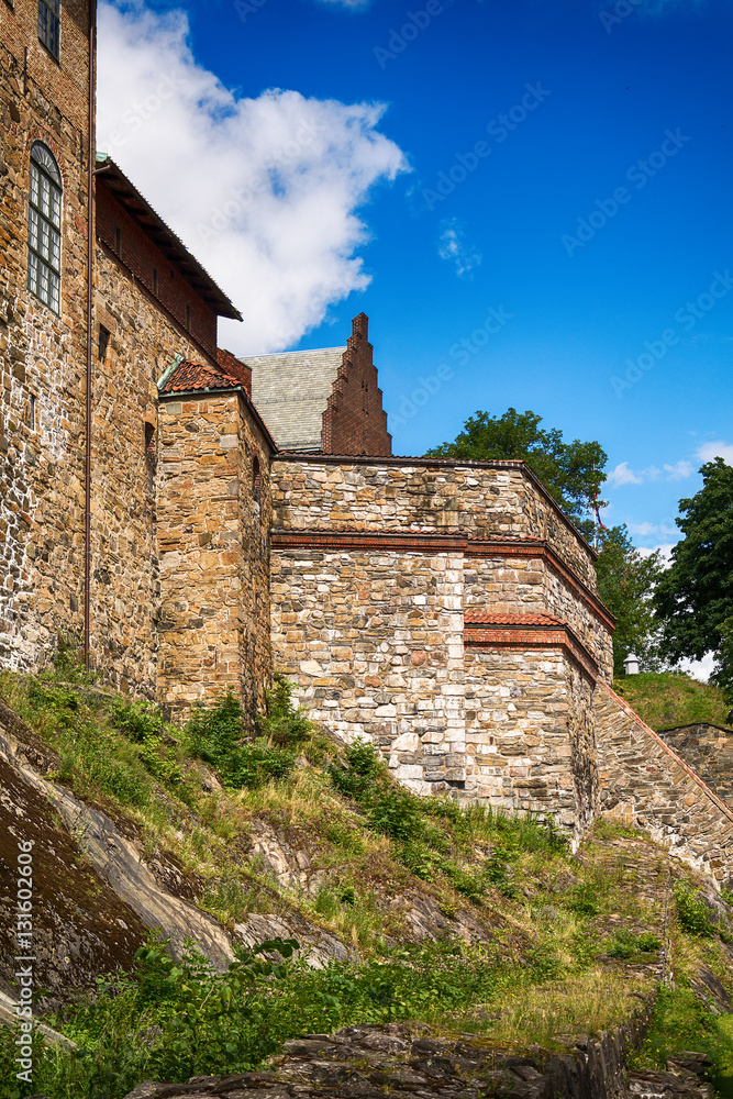 Oslo, Norway - July 18, 2016: Exterior of Akershus Fortress in Oslo, Norway. Akershus Fortress or Akershus Castle is a medieval castle that was built to protect Oslo, the capital of Norway. 