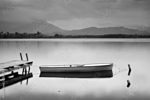 Fishing Boat on Pier, Lake Hopfensee in the Bavarian Alps, Black and White © AVTG