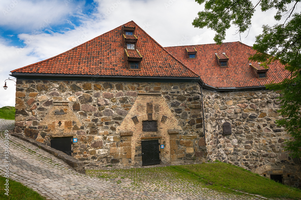 Oslo, Norway - July 18, 2016: Exterior of Akershus Fortress in Oslo, Norway. Akershus Fortress or Akershus Castle is a medieval castle that was built to protect Oslo, the capital of Norway. 