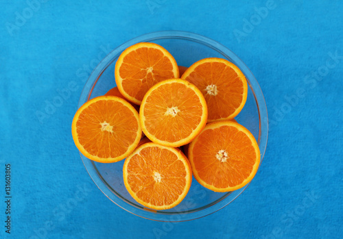 Six halves of oranges in glass bowl arranged in the form of flower