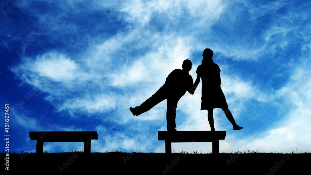 Obraz premium Children action in silhouette with background blue sky and white cloud