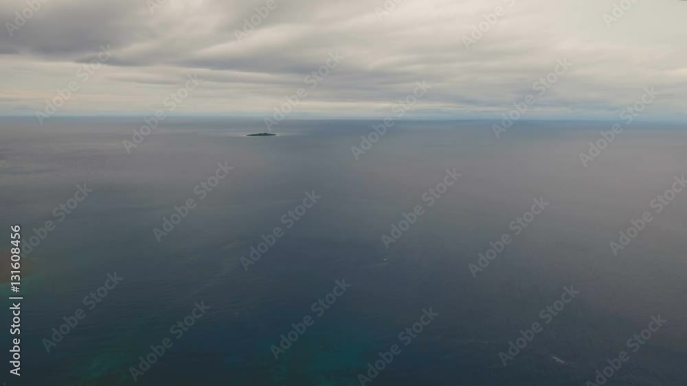 Aerial view of beautiful lonely tropical island in the open sea. Seascape: Beautiful view of the island in the ocean from the air. Landscape, sea, sky, clouds, island. Philippines. 4K video. Travel Aerial view of beautiful lonely tropical island in the open sea. Seascape: Beautiful view of the island in the ocean from the air. Landscape, sea, sky, clouds, island. Philippines. 4K video. Travel