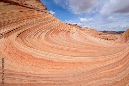 Sandstone Swirls - Layers of Colorful Sandstone at The Wave, a dramatic and colorful erosional sandstone rock formation located in North Coyote Buttes area at Arizona-Utah border. 