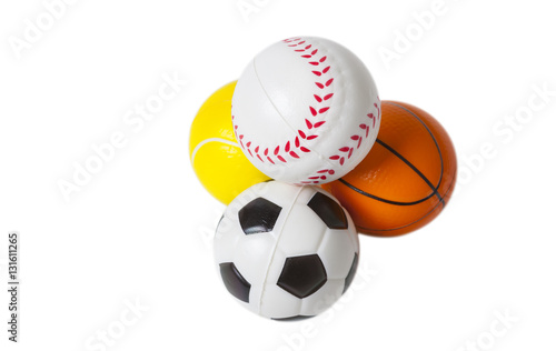 Four toy sports balls isolated on white background.
