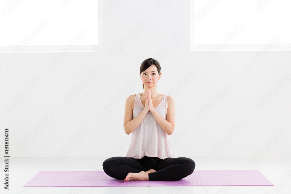 Fototapeta premium young asian woman exercising in sports gym