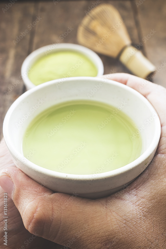 close-up matcha green tea with soft-focus in the background. over light and old film color tone close-up matcha green tea with soft-focus in the background. over light and old film color tone