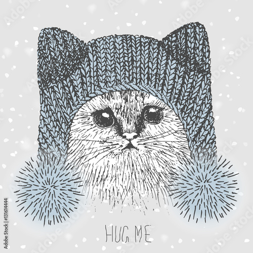 kitten in a knitted hat in the form of a cat. freehand drawing. vector
