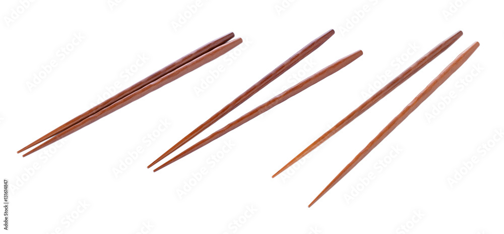 Wooden pairs of chopsticks on white background Wooden pairs of chopsticks on white background
