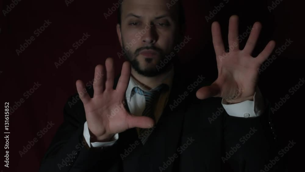 4k Shot of a Handsome Young Businessman Moving Invisible Holograms with Hands 4k Shot of a Handsome Young Businessman Moving Invisible Holograms with Hands
