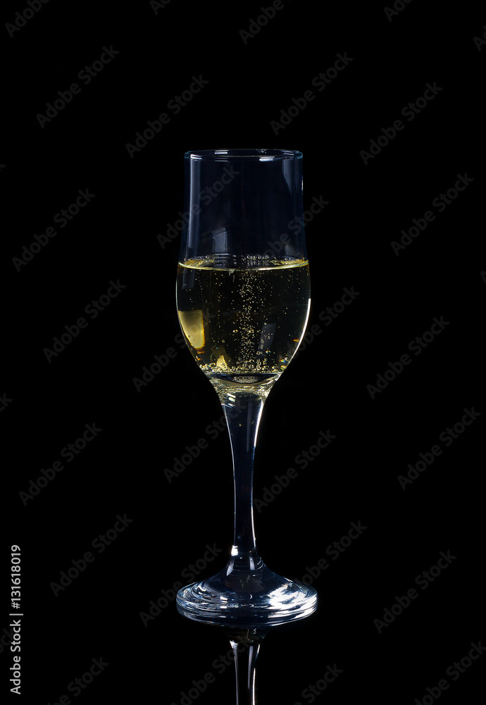 tulip glass of champagne on a black background tulip glass of champagne on a black background