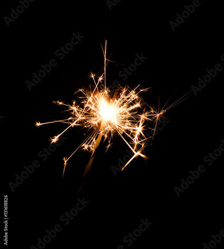 Christmas bengal fire isolated on black background