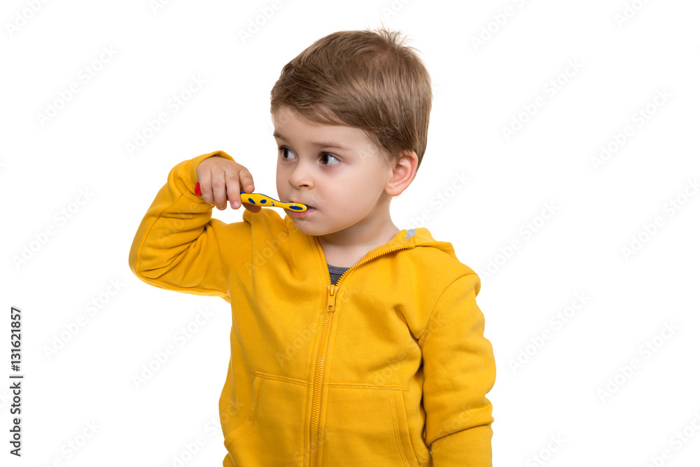 Little Boy Brushing Teeth on white background Little Boy Brushing Teeth on white background