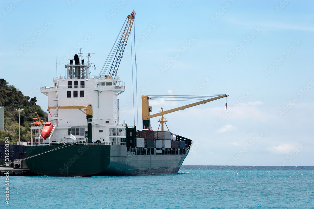 Cargo ship making ready to leave a Caribbean island port (Sint Maarten)