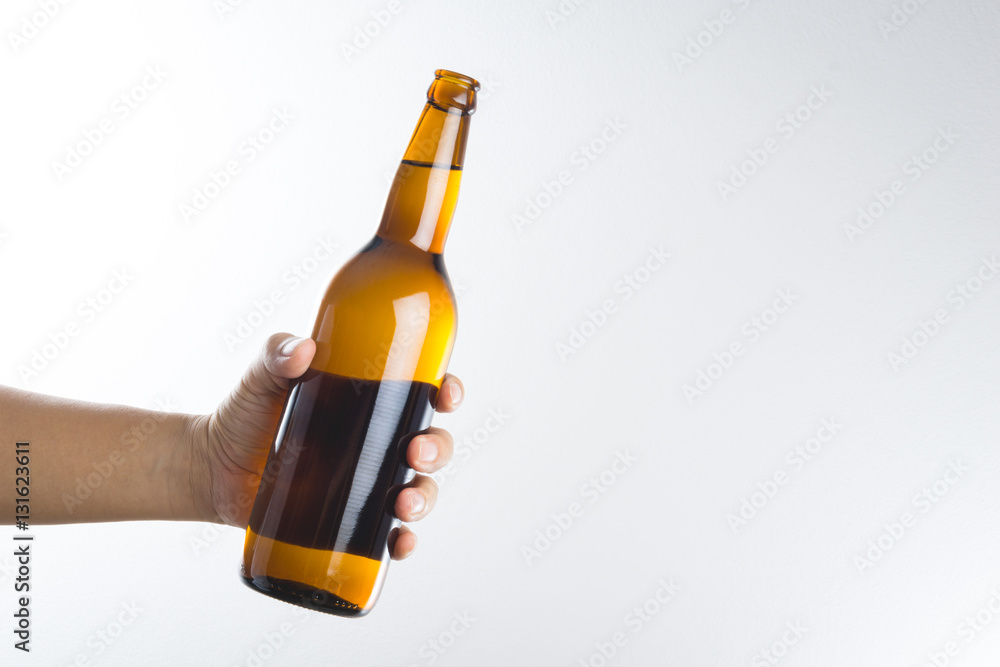 Hand holding a beer bottle Hand holding a beer bottle