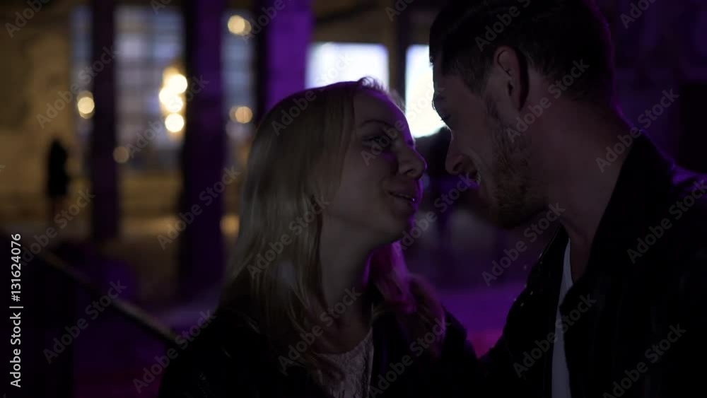 Attractive woman flirting with man on the street near night club, pick-up Attractive woman flirting with man on the street near night club, pick-up