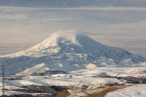 The formation and movement of clouds above the volcano Elbrus in the Caucasus Mountains in winter.