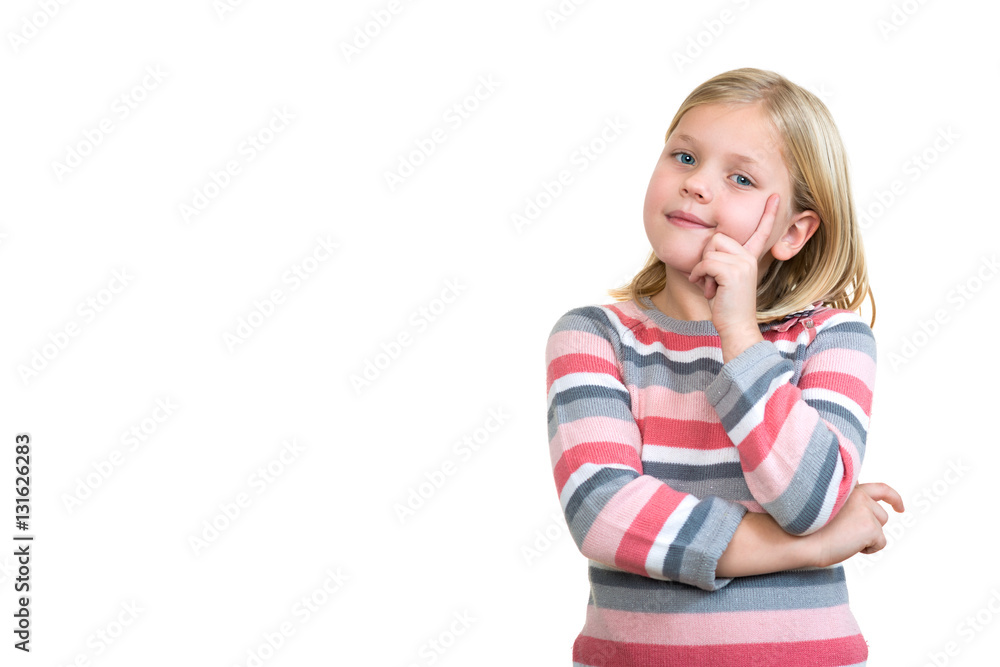 Little daydreamer. Cheerful little girl holding finger on chin and looking away Little daydreamer. Cheerful little girl holding finger on chin and looking away