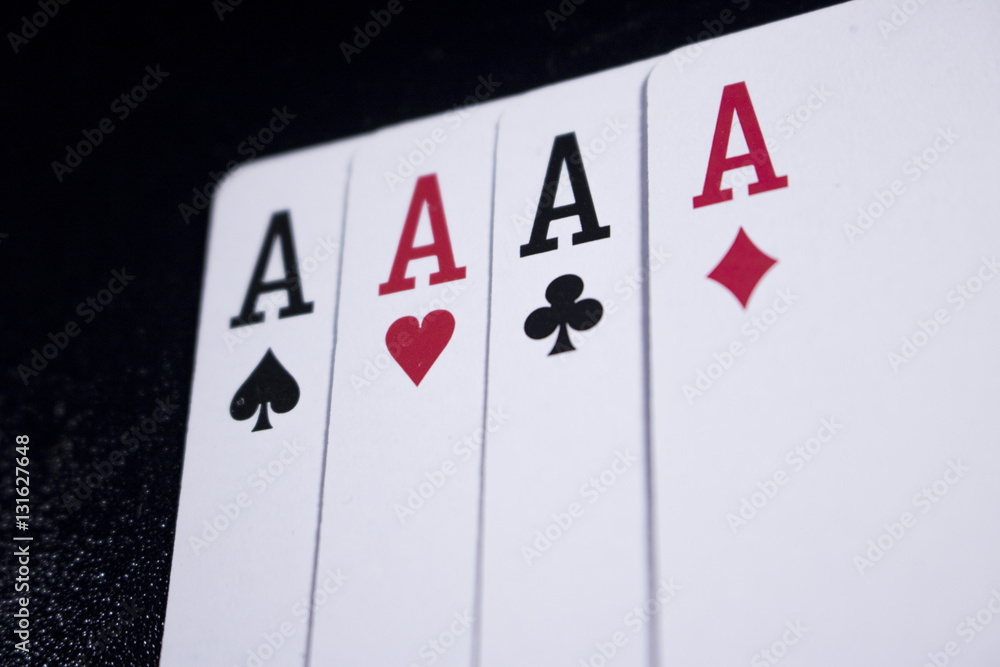 Obraz premium ace four of a kind poker card on dark black background