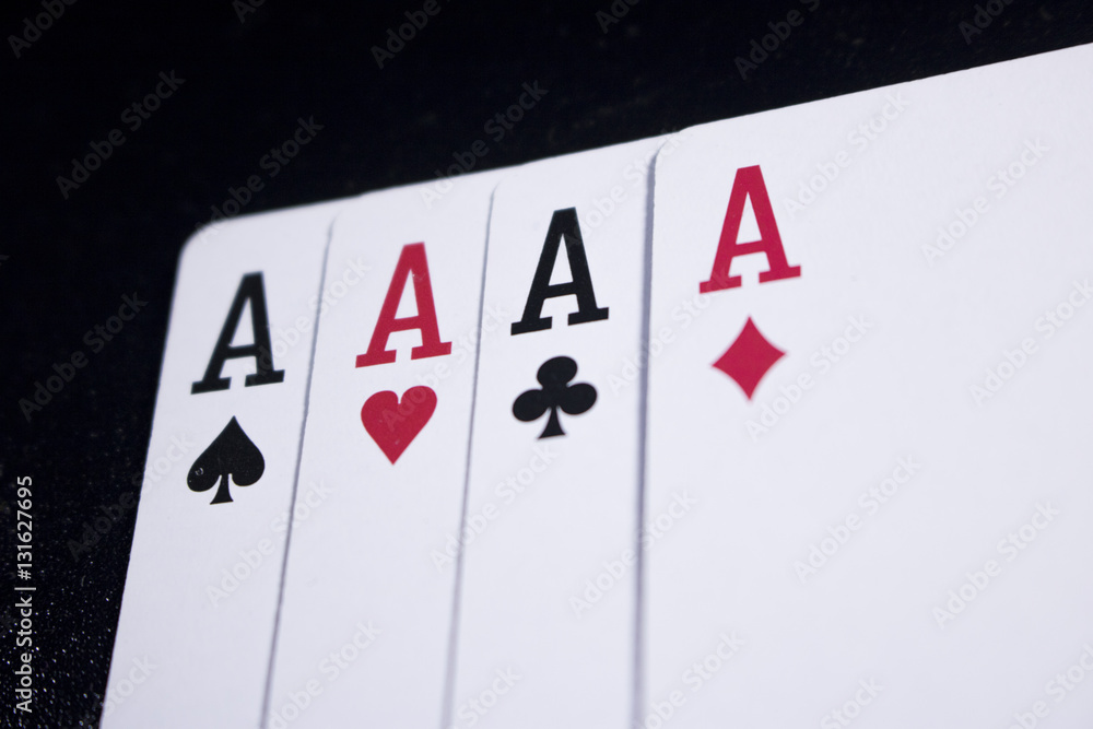 Obraz premium ace four of a kind poker card on dark black background