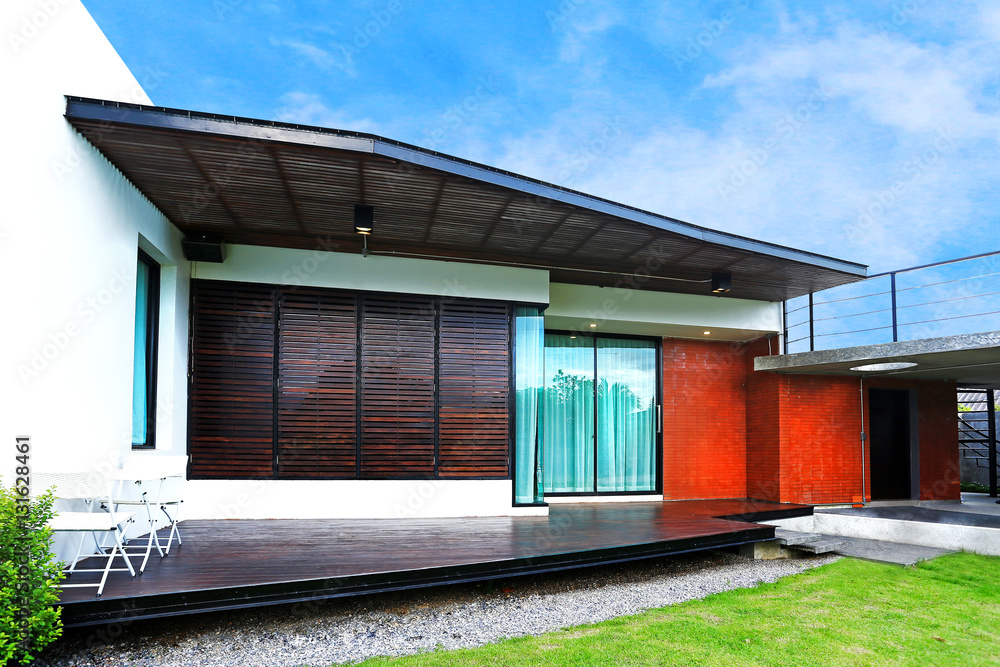 Fototapeta premium Architecture modern design in cement and wood with little garden and lawn