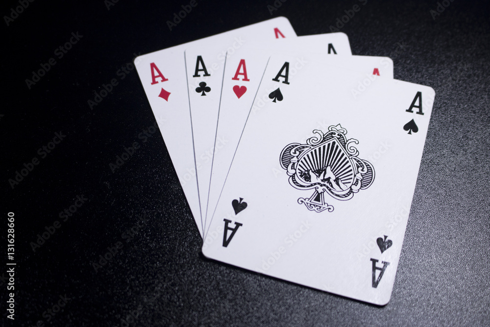 Obraz premium ace four of a kind poker card on dark black background
