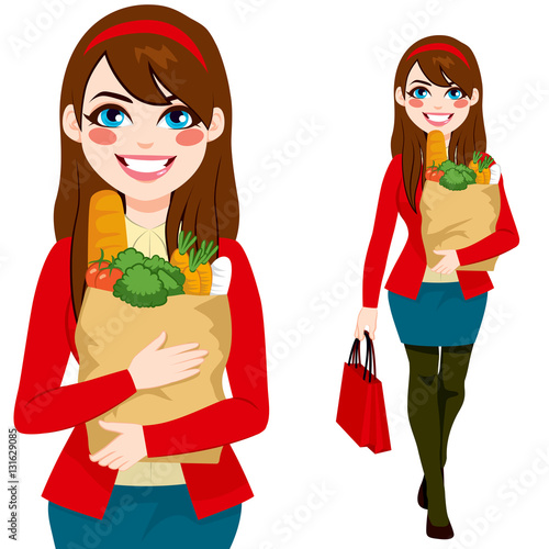 Beautiful brunette young woman carrying grocery paper shopping bag with healthy vegetables and food