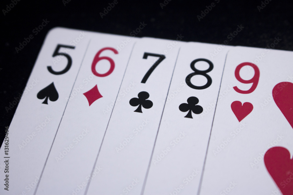 straight poker card on dark black background straight poker card on dark black background