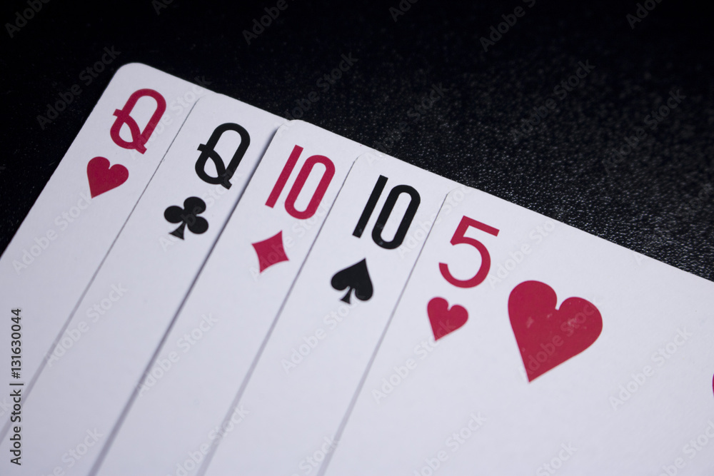 two pairs poker card on dark black background two pairs poker card on dark black background