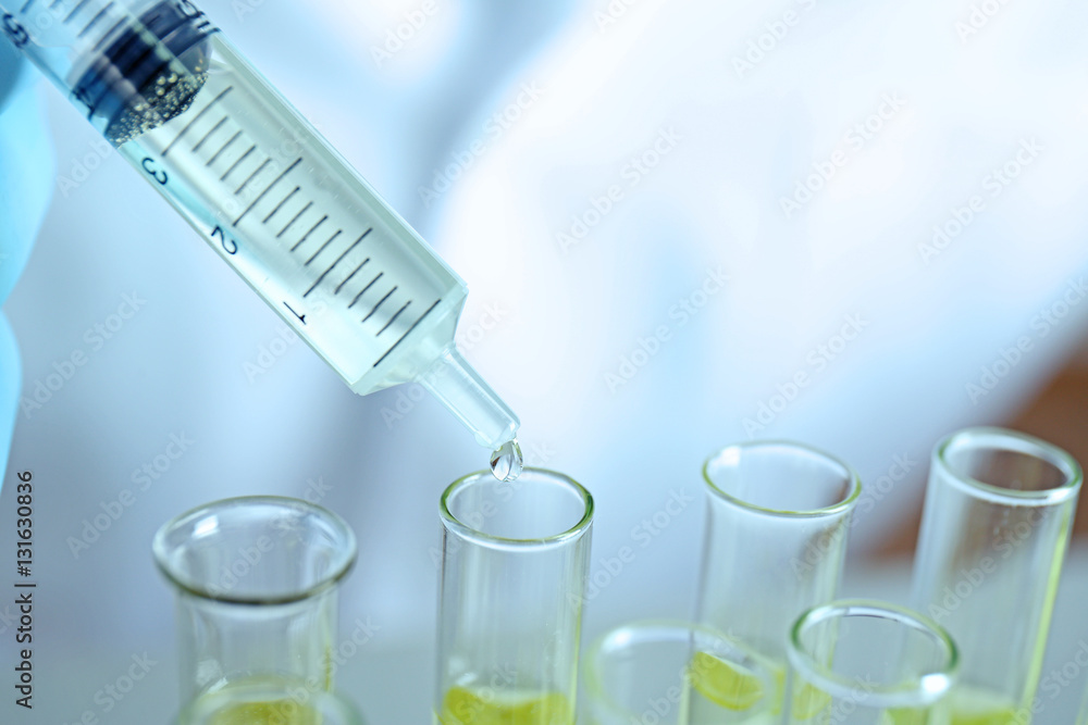 Doctor examining the urine in laboratory, closeup Doctor examining the urine in laboratory, closeup