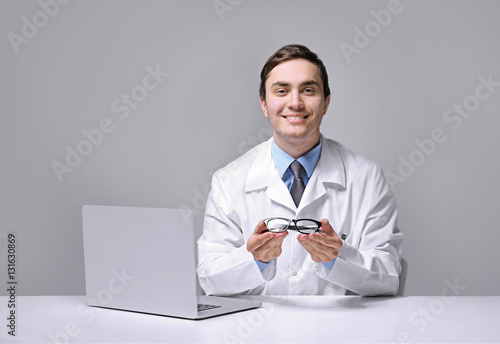 Young doctor with spectacle...