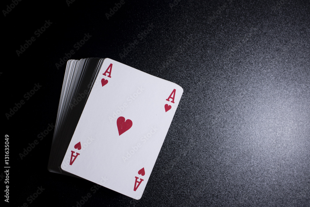 poker card stack deck on dark black background poker card stack deck on dark black background