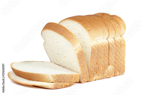 Fotobehang cut of loaf bread on white