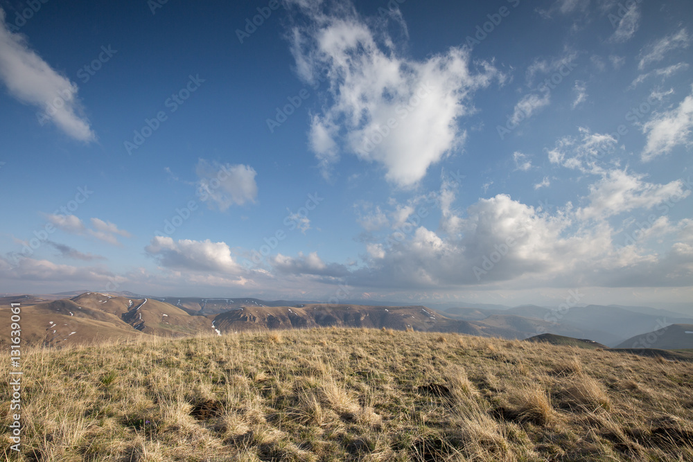 The formation and movement of spring clouds over the high Caucasus mountains