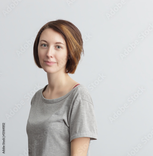 Woman in casual clothes calmly and confidently looking ahead