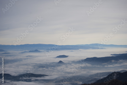 Valley in the mist. View from the mountains.