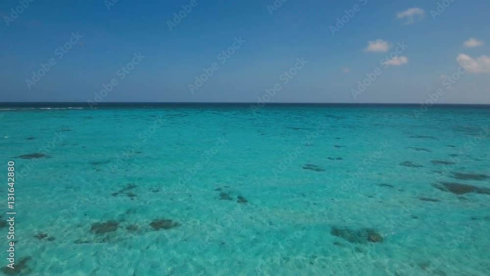 Flying over the blue sea in the azure lagoon. Aerial view: water surface. Tropical sea. Philippines. Flying over the azure surface of the ocean. 4K video. Travel concept. Aerial footage. Flying over the blue sea in the azure lagoon. Aerial view: water surface. Tropical sea. Philippines. Flying over the azure surface of the ocean. 4K video. Travel concept. Aerial footage.