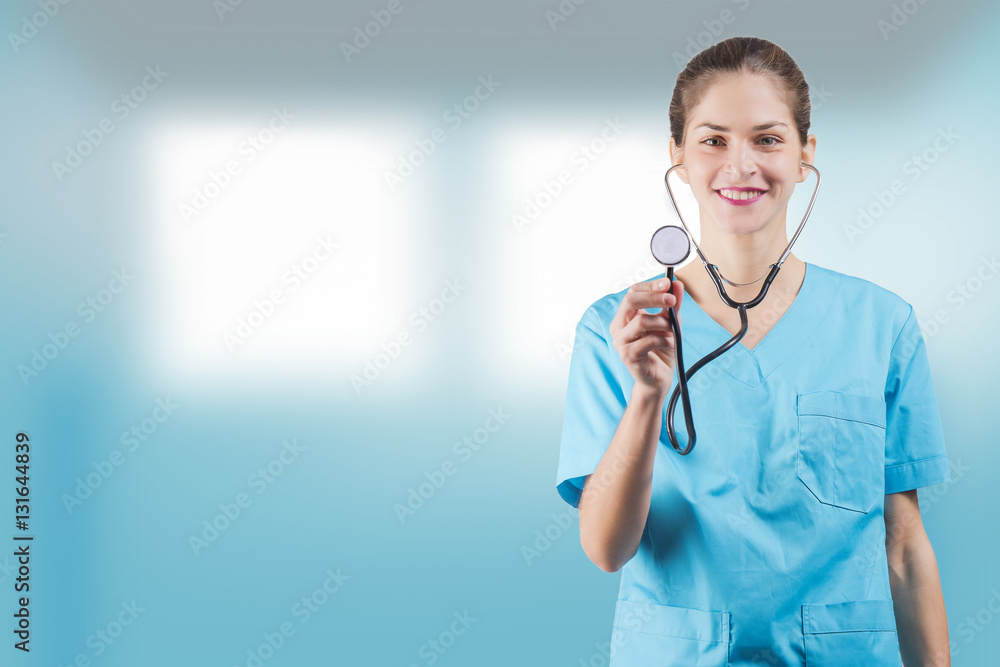 beautiful woman nurse or doctor is holding a stethoscope with copy space for advertising