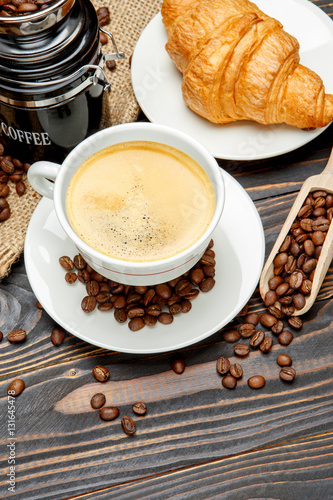 Fototapeta Naklejka Na Ścianę i Meble -  cup of coffe and croissant on wooden background