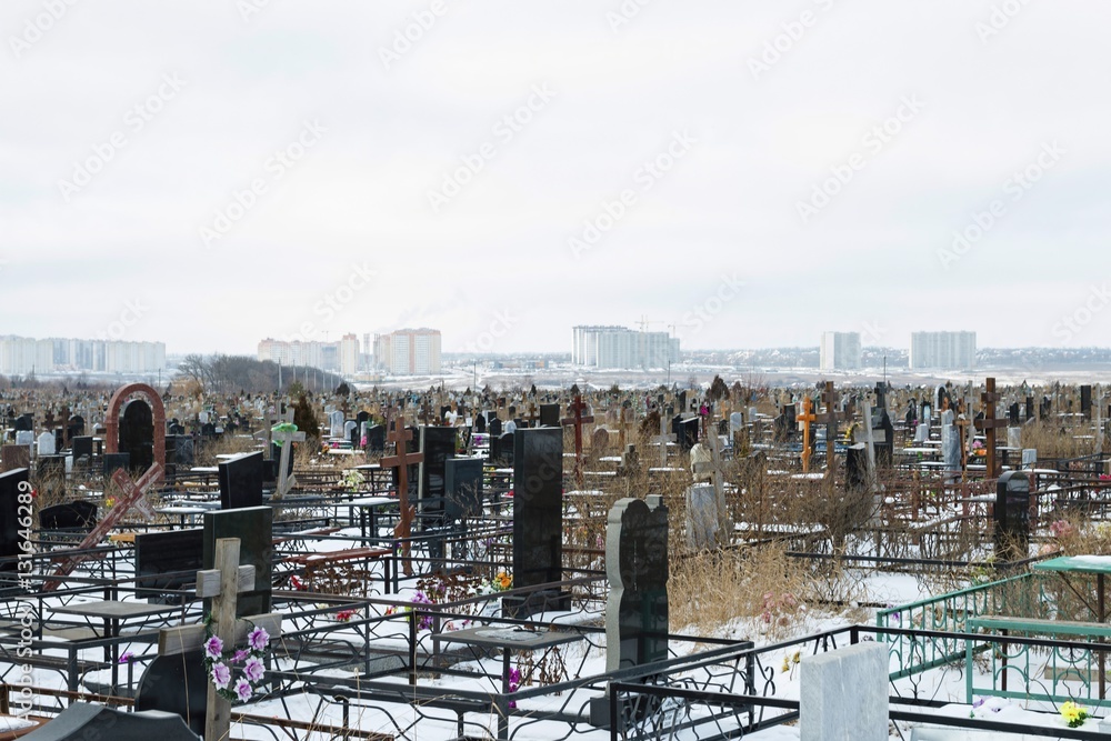 Old cemetery in winter time. Stock image.