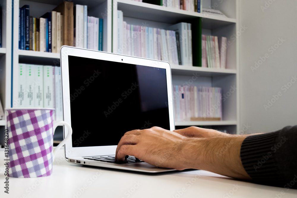 Guy or man or student or businessman working on laptop with a bl Guy or man or student or businessman working on laptop with a bl