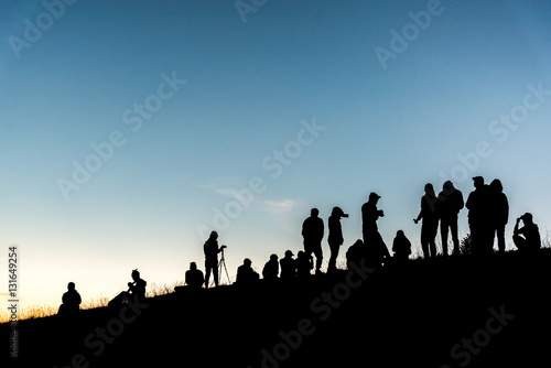 Group of people on peak mountain.