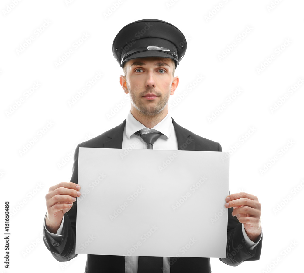 Young chauffeur holding white board on white background Young chauffeur holding white board on white background