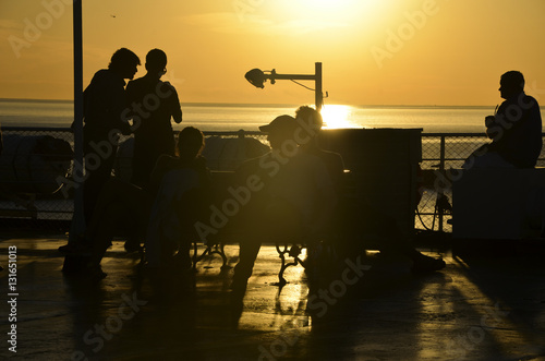 people silohuette at sunset